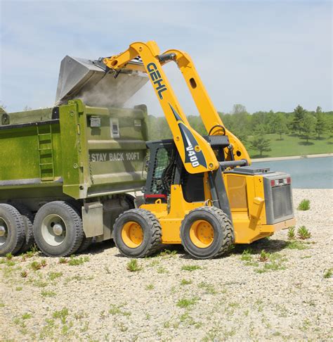 lifted skid steer|vertical lift skid steer.